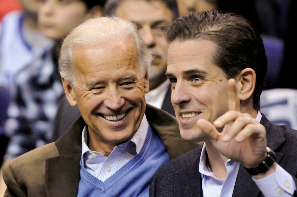 Then-US Vice President Joe Biden and his son Hunter Biden attend an NCAA basketball game between Georgetown University and Duke University in Washington January 30, 2010. — Reuters file pic