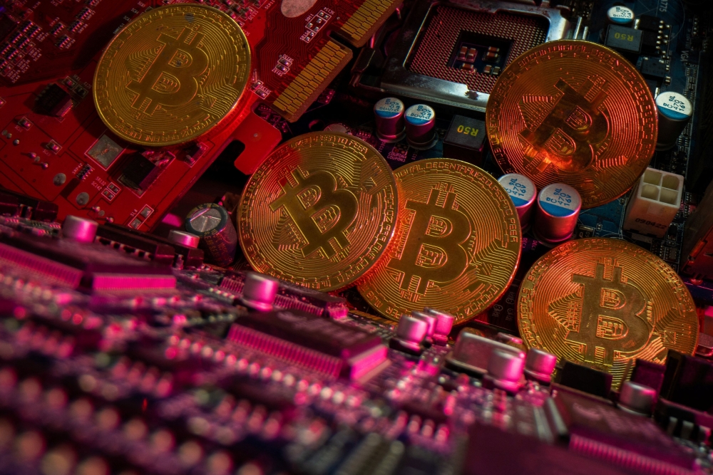 Representations of cryptocurrency Bitcoin are placed on a PC motherboard, in this illustration taken June 16, 2023. — Reuters pic