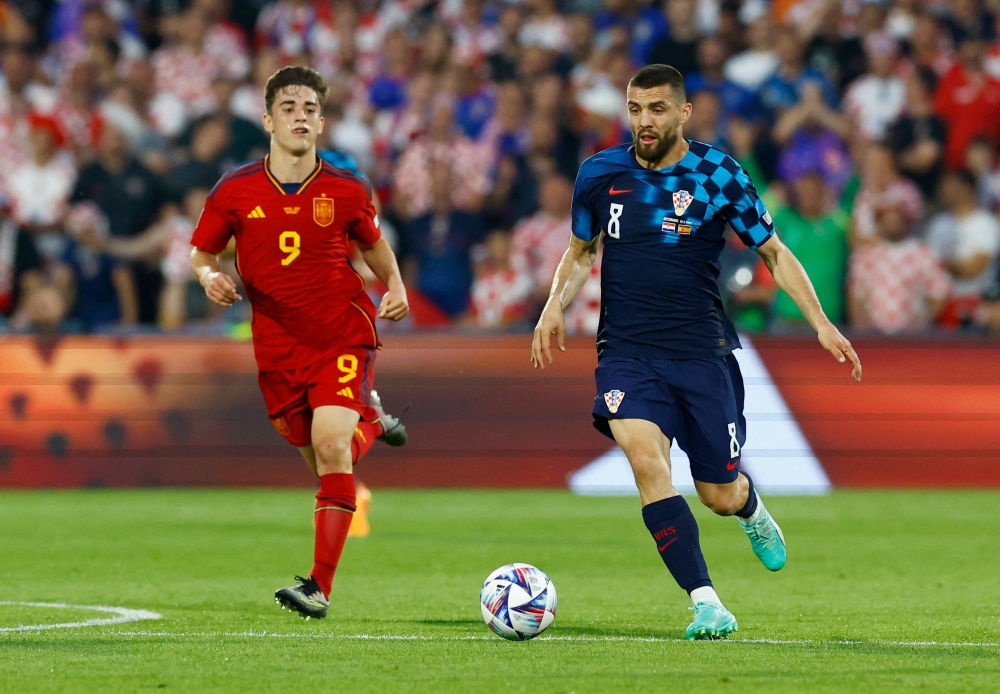 Croatia’s Mateo Kovacic in action with Spain’s Gavi during the Uefa Nations League final at Feyenoord Stadium, Rotterdam, Netherlands, June 18, 2023. — Reuters pic 