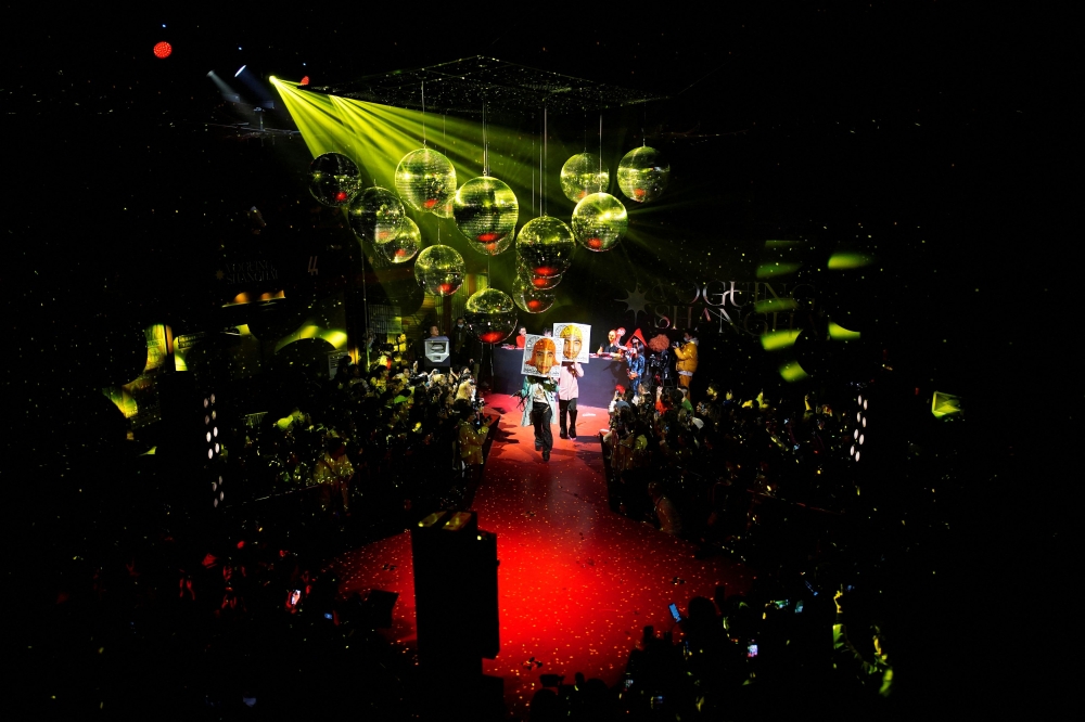 Participants perform on stage during a voguing 