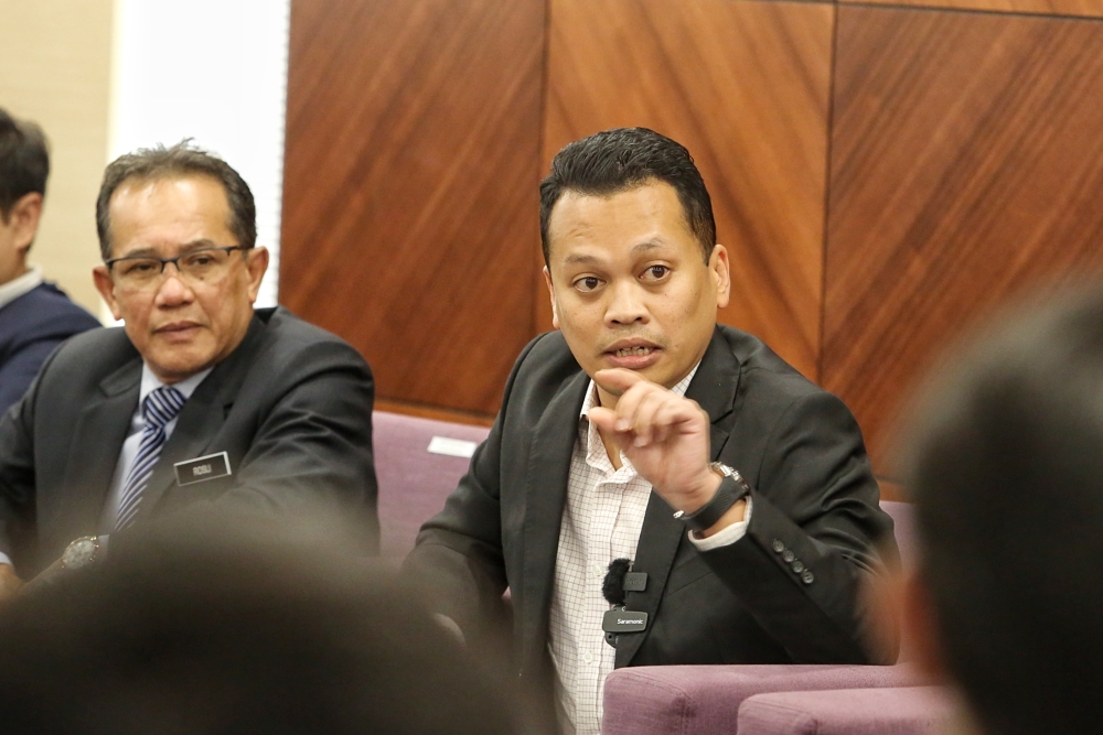 Natural Resources, Environment and Climate Change Minister Nik Nazmi Nik Ahmad speaks at a press conference at his ministry in Putrajaya, June 23, 2023. — Picture by Choo Choy May.