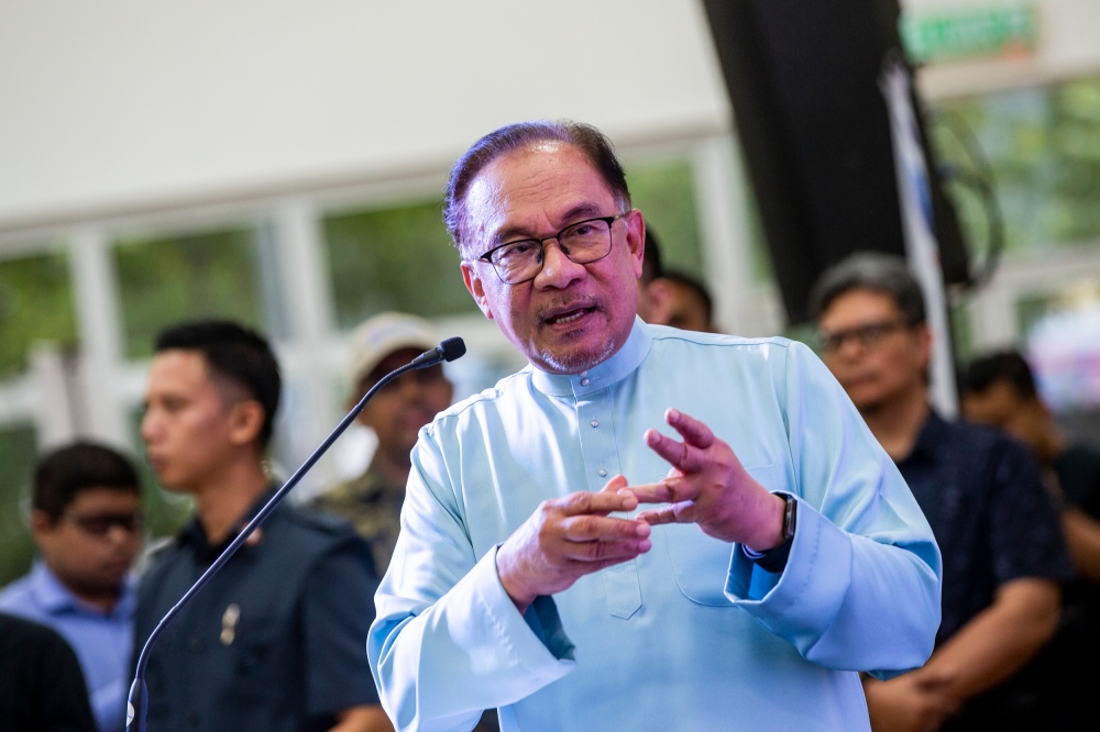 Prime Minister Datuk Seri Anwar Ibrahim delivers a speech at the launch of Metropolitan Lake Park multi-storey car at PPAM Metropolitan Kepong, June 23, 2023. — Picture by Hari Anggara