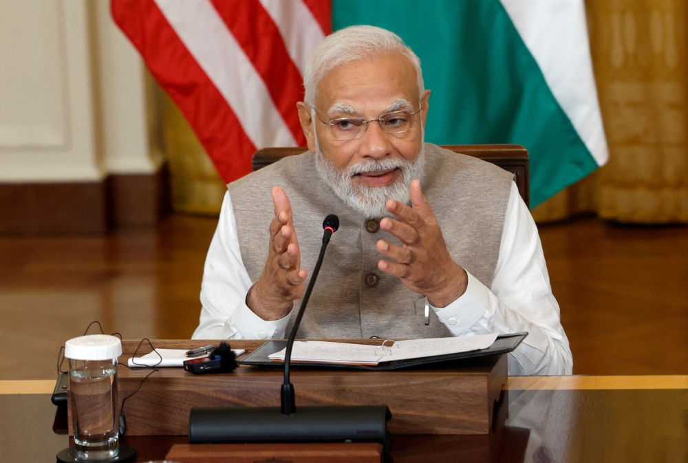 India's Prime Minister Narendra Modi gestures during a meeting with US President Joe Biden and senior officials and CEOs of American and Indian companies in the East Room of the White House in Washington June 23, 2023. ― Reuters pic