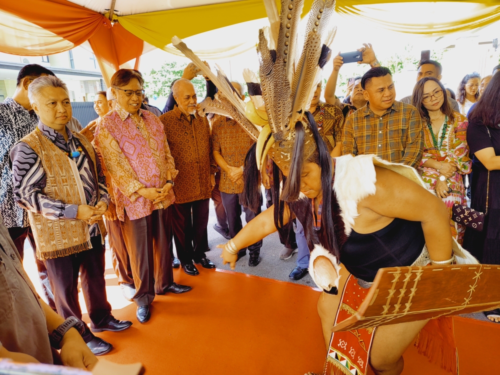 Sarawak Premier Tan Sri Abang Johari Openg (second left) being welcomed with an Iban Ajat performance on arrival at the residence of Deputy Minister of Tourism, Creative Industry and Performing Arts Datuk Snowdan Lawan, June 24, 2023. — Picture by Sulok Tawie