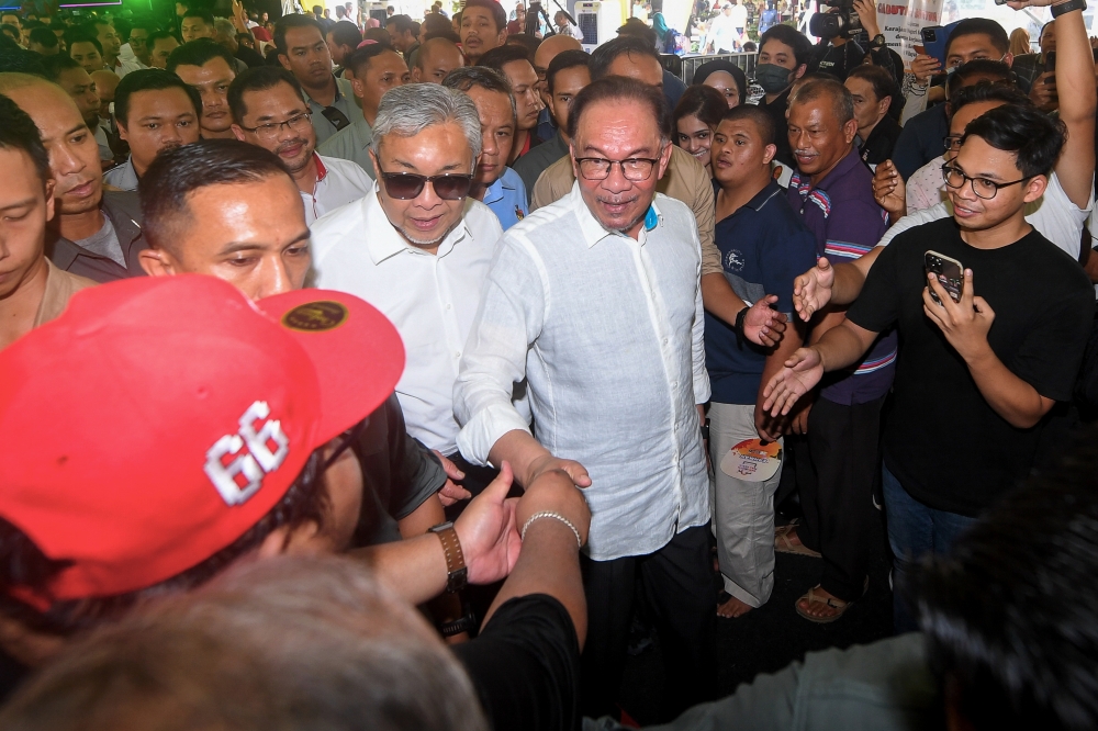 Prime Minister Datuk Seri Anwar Ibrahim greets guests at the Sentuhan Kasih Desa programme in Nilai June 24, 2023. ― Bernama pic