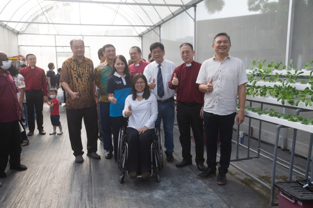 (From left to right) CIMB Head of Corporate Responsibility Rositah Mariam  Sulaiman, Beautiful Gate Foundation Acting Executive Director Ivy Pua, Beautiful Gate Foundation Director Brother Chiew Toh Hie, Beautiful Gate Foundation Chairman Reverend Liew Kek Ming, and Selangor DAP secretary Ng Sze Han at the greenhouse launch this morning. — Picture by Hari Anggara
