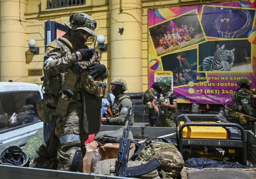 Fighters of Wagner private mercenary group pull out of the headquarters of the Southern Military District to return to base, in the city of Rostov-on-Don, Russia, June 24, 2023. — Reuters pic