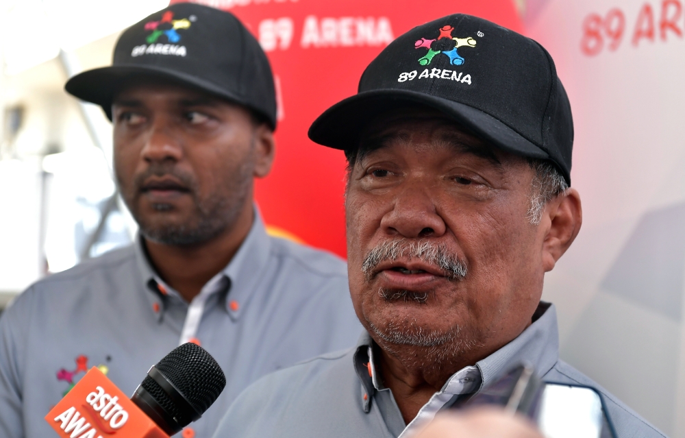 Agriculture and Food Security Minister Datuk Seri Mohamad Sabu (right) speaks to reporters after officiating the 89 Arena Sports Complex in Klang June 25, 2023. — Bernama pic