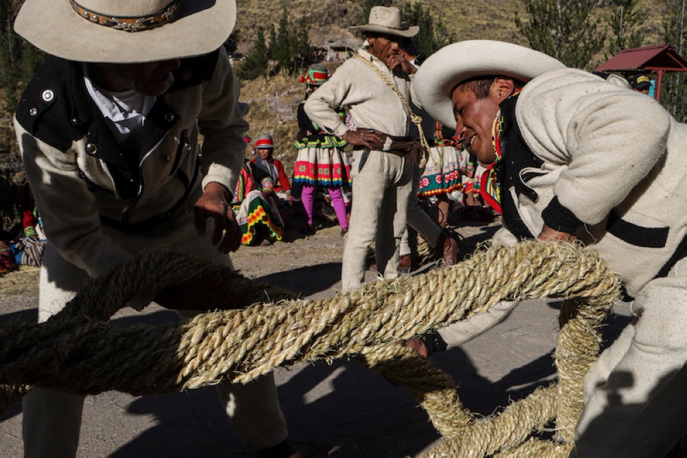 People from different communities participate in the annual renovation of the Q'eswachaka rope bridge. — AFP pic