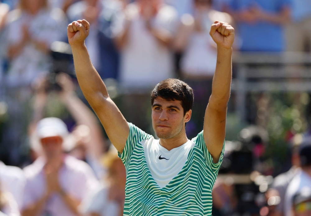 Spain's Carlos Alcaraz celebrates after winning his final match against Australia's Alex de Minaur at the Queen's Club in London June 25, 2023. — Picture by Peter Cziborra/Action Images via Reuters