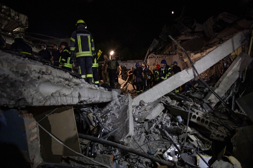 A Russian missile struck a restaurant in the eastern Ukrainian city of Kramatorsk yesterday, killing at least eight people and wounding 56, emergency services said, as rescue crews combed the rubble in search of casualties. — Reuters pic