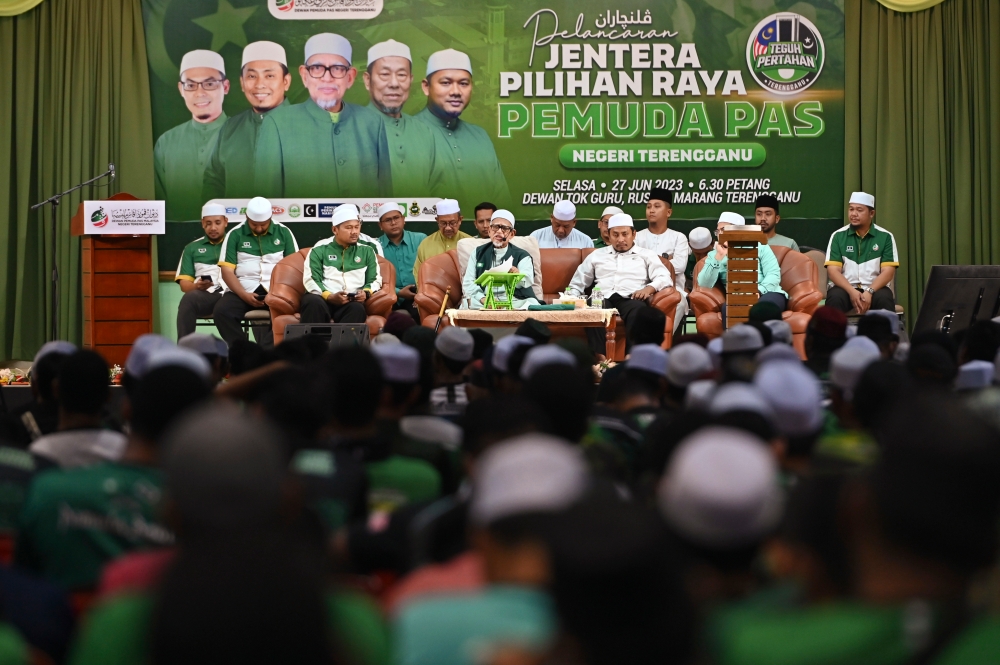 PAS president Tan Sri Abdul Hadi Awang (centre) speaks during the launch of the party’s election machinery at Dewan Tok Guru Masjid Rusila, Marang, Terengganu, June 28, 2023. — Bernama pic 