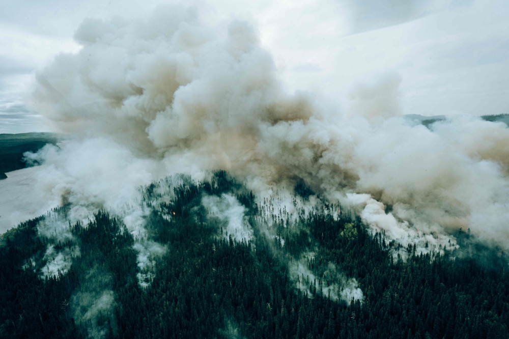 This June 7, 2023, aerial image released by the Societe De Protection Des Forets (SOPFEU) on June 29, 2023, shows a controled burn to fight wildfires in Canada's Quebec Province. — AFP pic