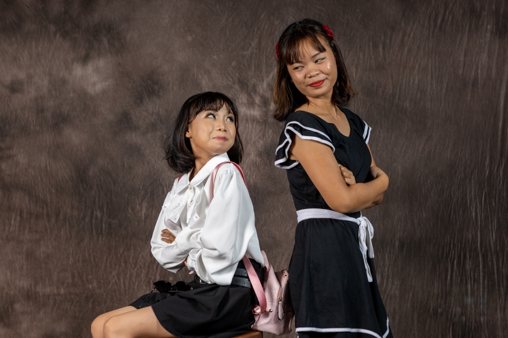 Jessica and Jeslina (right) having a blast at the photoshoot. ― Picture courtesy of CWS Malaysia