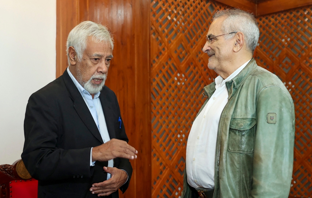 East Timorese Prime Minister-elect Xanana Gusmao (left) chats with East Timorese President Jose Ramos Horta in Dili on June 29, 2023, ahead of Gusmao’s inauguration on June 31, 2023. — AFP pic