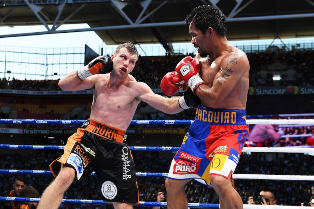 Jeff Horn of Australia punches Manny Pacquiao of the Philippines during their WBO World Welterweight Title fight in Brisbane July 2, 2017. — Reuters pic