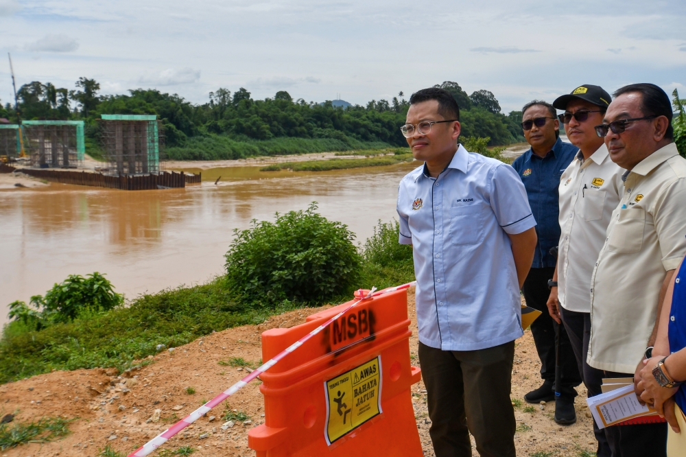 Natural Resources, Environment, and Climate Change Minister and Kelantan State Development Action Council joint chairman Nik Nazmi Nik Ahmad visits the site of the Sungai Kelantan riverbank development project in Machang July 2, 2023. — Bernama pic