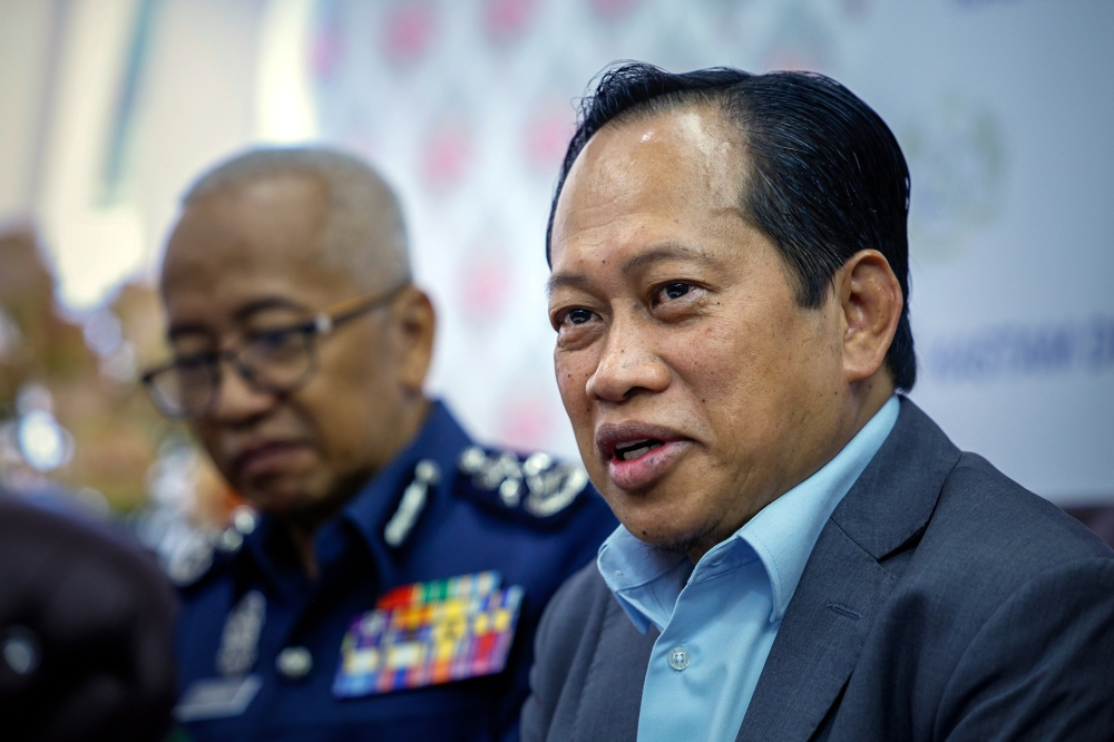 Deputy Finance Minister I Datuk Seri Ahmad Maslan (right) speaks during a press conference at the Regional Office for Capacity Building in Bukit Baru, Melaka July 3, 2023. — Bernama pic
