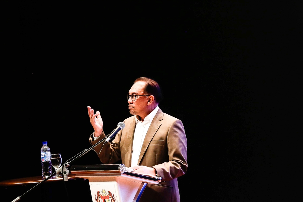 Prime Minister Datuk Seri Anwar Ibrahim delivers a speech at the launch of the book 'Adab Perbezaan Pendapat Dalam Islam' here at the Jakim Auditorium in Kompleks Islam Putrajaya July 4, 2023. — Picture by Sayuti Zainudin