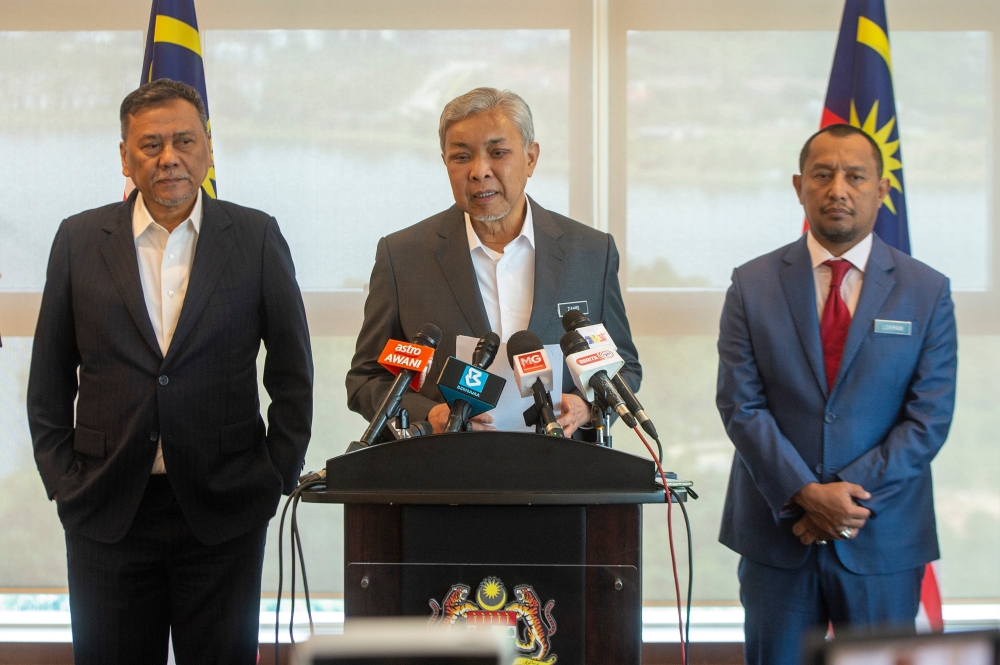 Deputy Prime Minister Datuk Seri Ahmad Zahid Hamidi (centre) addresses the media at a press conference in Kuala Lumpur July 4, 2023. — Picture by Shafwan Zaidon