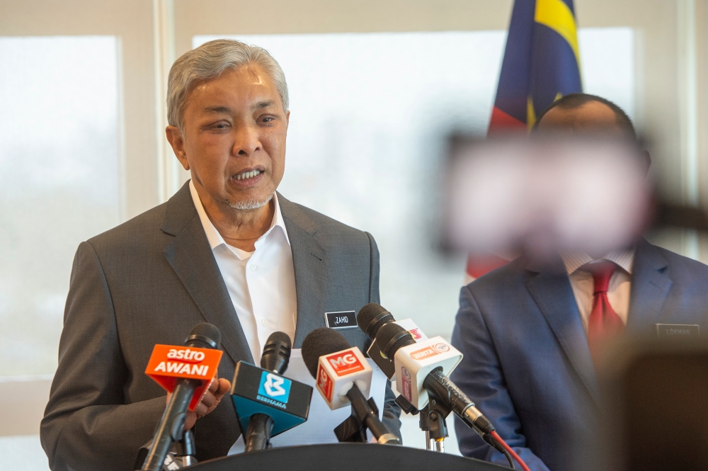 Deputy Prime Minister Datuk Seri Dr Ahmad Zahid Hamidi speaks to the media during the press conference after charing the National Action Council on Cost of Living Meeting at Rural and Regional Development Ministry in Putrajaya, 4 July 2023. — Picture by Shafwan Zaidon