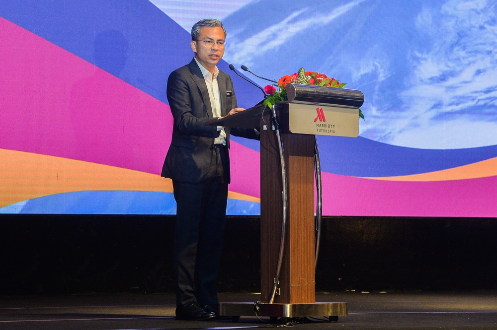 Minister of Communication and Multimedia Fahmi Fadzil speaks at the Courier Industry Appreciation Day in Putrajaya July 04,2023. — Picture by Miera Zulyana