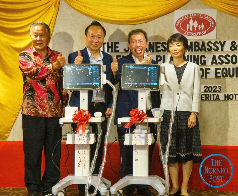 (From right) Kako Shiho, Deputy Premier Datuk Seri Dr Sim Kui Hian, Dr Philip Kho, and SPFA adviser Datuk Yong Khoon Seng with the donated ultrasound machines. — Picture by Muhammad Rais Sanusi