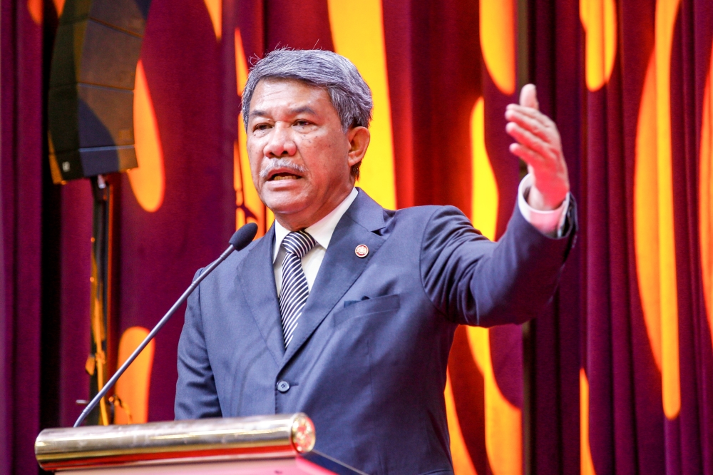 Defence Minister Datuk Seri Mohamad Hasan delivers a speech at the ATM Education Carnival launch ceremony and handover of Dermasiswa Premium and laptops at Wisma Pertahanan, Kuala Lumpur, July 4, 2023. — Picture by Hari Anggara