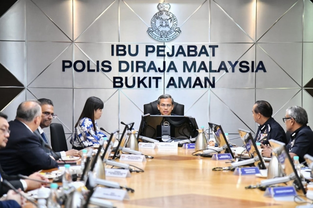 Communications and Digital Minister Fahmi Fadzil chairs a meeting with Meta, MCMC and PDRM at the police headquarters in Bukit Aman, July 4, 2023. — Picture from Facebook/Fahmi Fadzil 