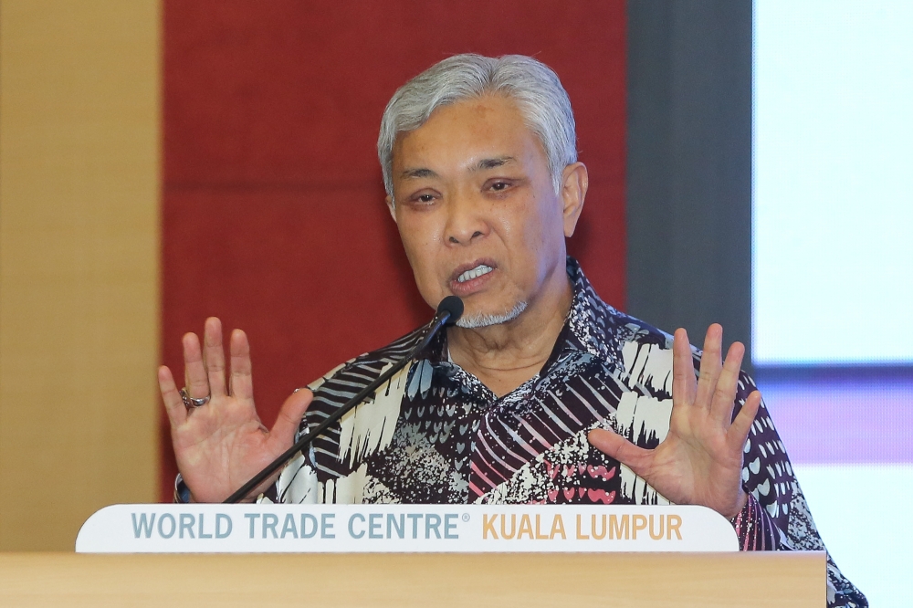 Deputy Prime Minister Datuk Seri Ahmad Zahid Hamidi speaks during the launch of the Formalising the Informal Entrepreneurs Plan ceremony at World Trade Centre in Kuala Lumpur July 6, 2023. — Picture by Yusof Mat Isa