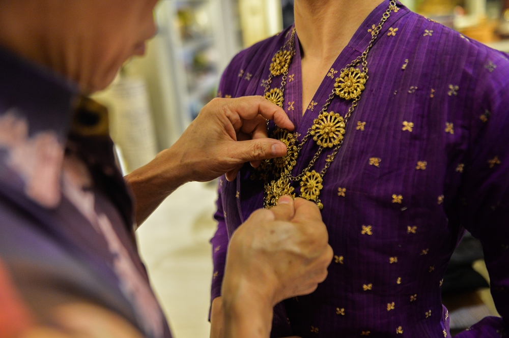A model wears a Kebaya Songket Melayu Palembang from Sumatera in Kuala Lumpur, April 12, 2023. — Picture by Miera Zulyana