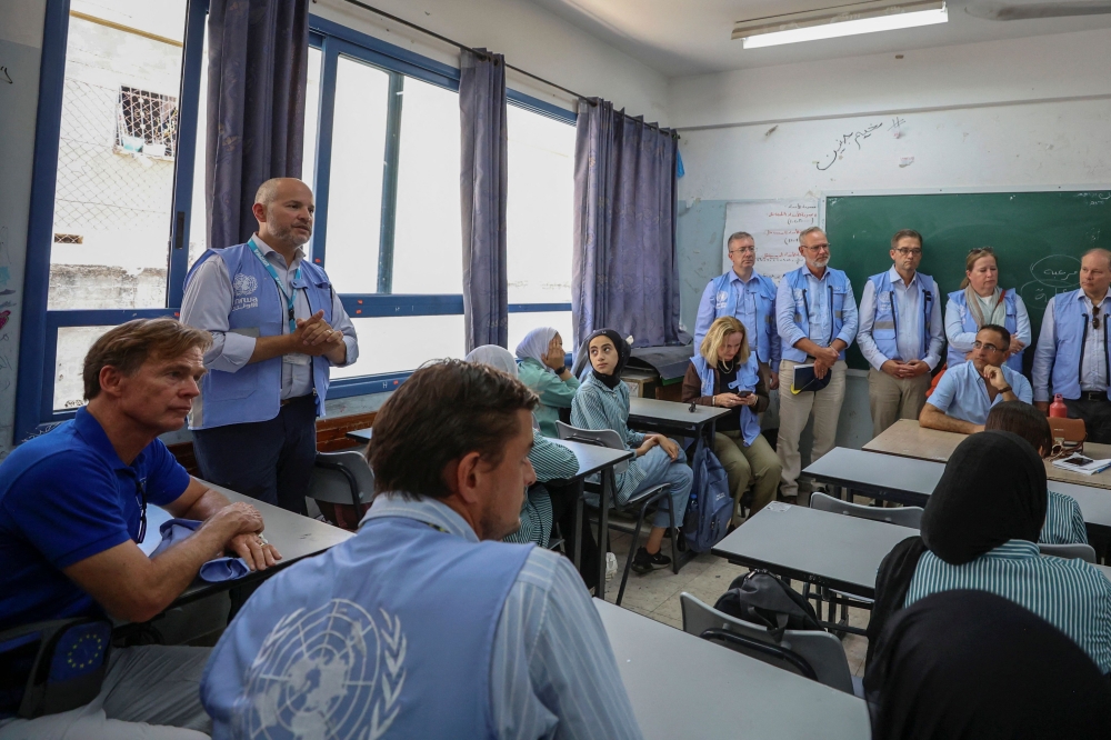 European Union representative to the Palestinian territories Sven Kuehn von Burgsdorff (left) and a delegation of international envoys visit the visit the UNRWA camp school as they tour the Jenin refugee camp in the Israeli-occupied West Bank, on July 8, 2023. — AFP pic