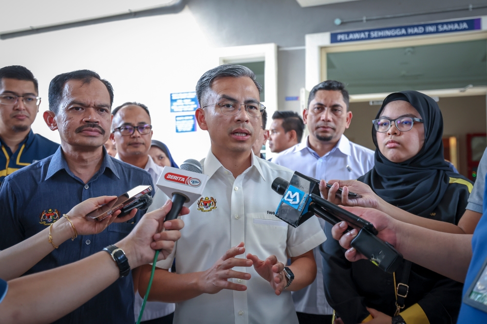 Communications and Digital Minister Fahmi Fadzil speaks to reporters in Shah Alam July 9, 2023. — Bernama pic