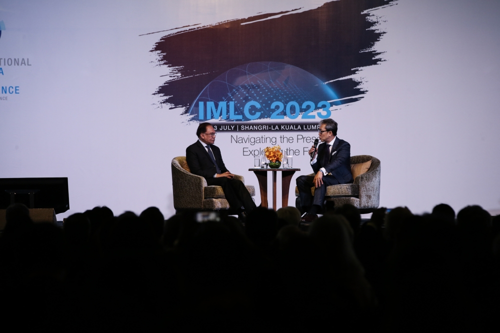 Prime Minister Datuk Seri Anwar Ibrahim (left) attends the International Malaysia Law Conference 2023 in Kuala Lumpur July 10, 2023. — Picture by Ahmad Zamzahuri