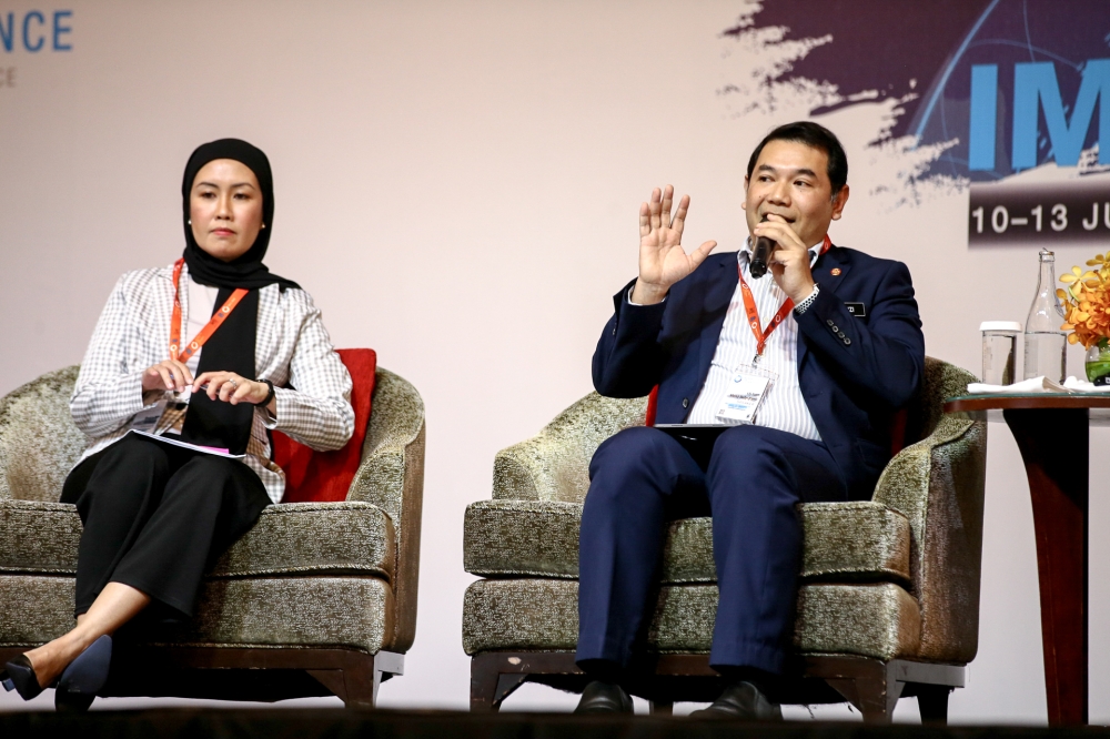 Economy Minister Rafizi Ramli (right) speaks during the International Malaysia Law Conference at Shangri-La Kuala Lumpur July 11, 2023. — Picture by Ahmad Zamzahuri