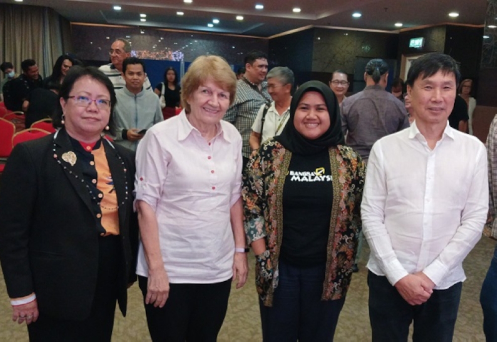 Former Sabah State Health director Datuk Dr Christina Rundi (left) stresses the importance of the struggle to ensure all children who are in Sabah are immunised. — Borneo Post