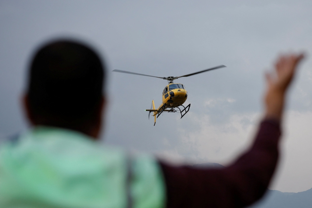Nepal’s aviation regulator has banned helicopters from conducting “non-essential” flights, including those for sight-seeing, for two months, after a deadly crash in the Everest region in which six people were killed. — Reuters pic