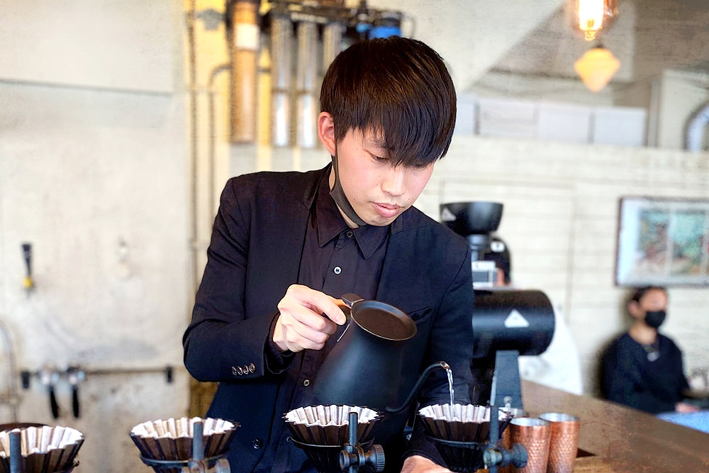Barista brewing coffee at Glitch Coffee Roasters in Tokyo, Japan. — Pictures by CK Lim