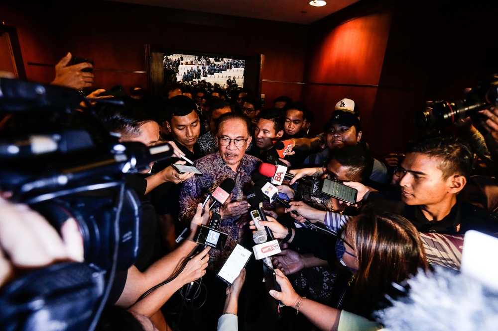 Prime Minister Datuk Seri Anwar Ibrahim speaks to the media after a dialogue session with enforcement agencies at the Putrajaya International Convention Centre, July 13, 2023. — Picture by Sayuti Zainudin 