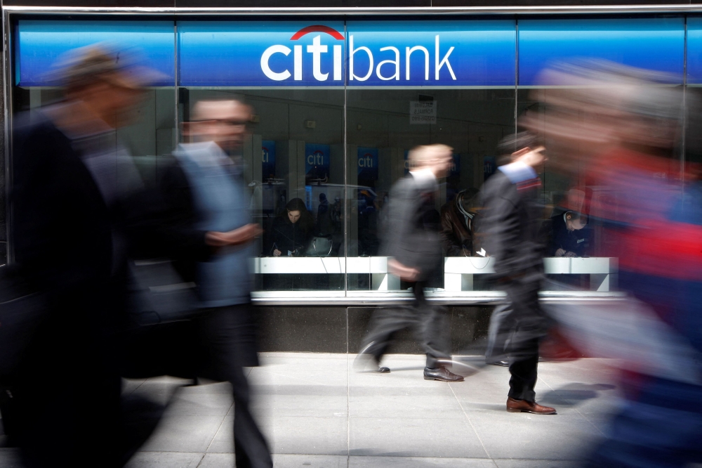 People walk past a CitiBank branch on Avenue of the Americas, in New York, April 9, 2008. — Reuters pic