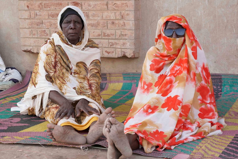File phot of internally displaced Sudanese residing in the Hasahisa secondary school on July 10, 2023, transformed to house people fleeing violence in the war-torn country. — AFP pic