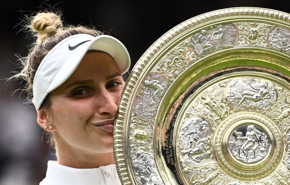 Czech Republic’s Marketa Vondrousova celebrates as she kisses the Venus Rosewater Dish trophy during the prize ceremony after winning the women’s singles final tennis match against Tunisia’s Ons Jabeur on the thirteenth day of the 2023 Wimbledon Championships at The All England Lawn Tennis Club in Wimbledon, southwest London, on July 15, 2023. — AFP pic