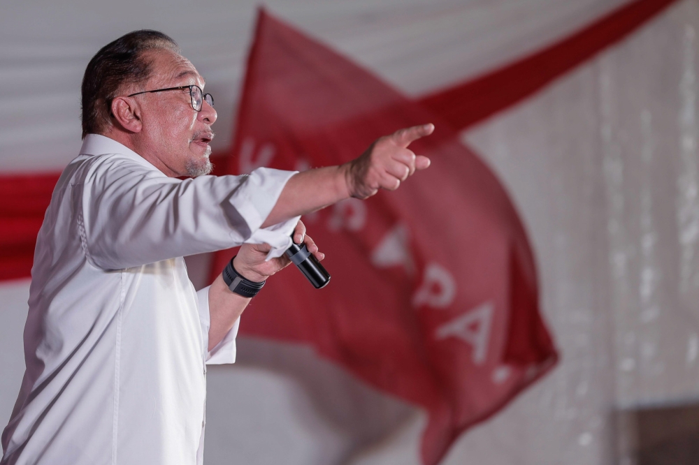 Prime Minister Datuk Seri Anwar Ibrahim speaks at the ‘Madani Unity’ roadshow and the launch of the Penang Unity Machinery at the Seberang Jaya Expo site in Permatang Pauh July 17, 2023. — Bernama pic