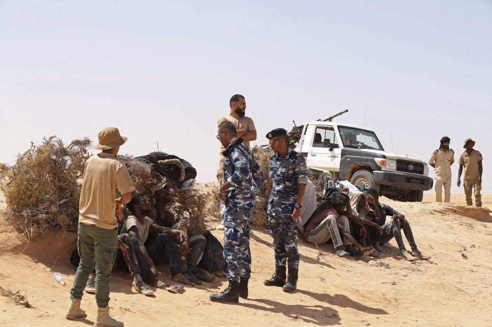 Libya border guards rescue migrants in desert near Tunisia | Malay Mail