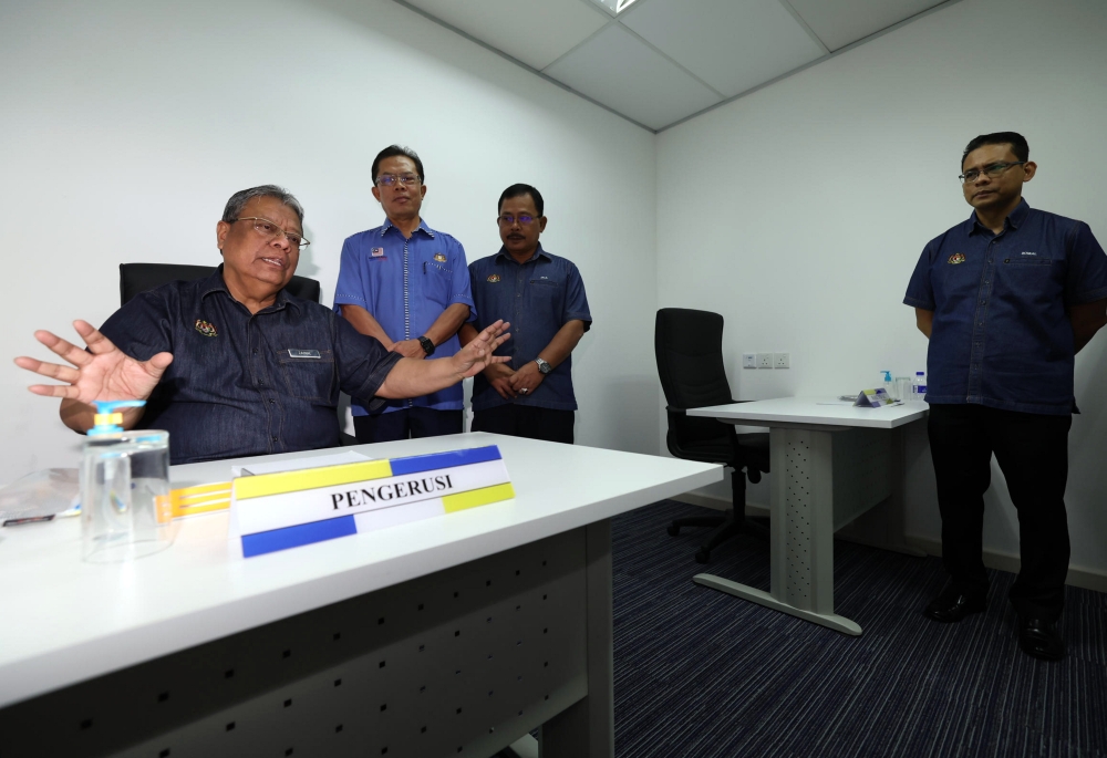 Public Service Commission (SPA) chairman Tan Sri Zainal Rahim Seman speaks to reporters after officially opening the Johor Baru SPA Interview Centre at the Urban Transformation Centre, July 17, 2023. — Bernama pic