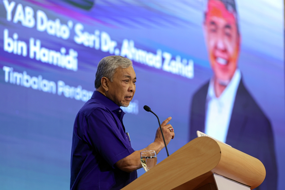 Deputy Prime Minister Datuk Seri Ahmad Zahid Hamidi delivers a speech during the Gig Industry Career Framework National Forum in Kuala Lumpur July 17, 2023. — Bernama pic