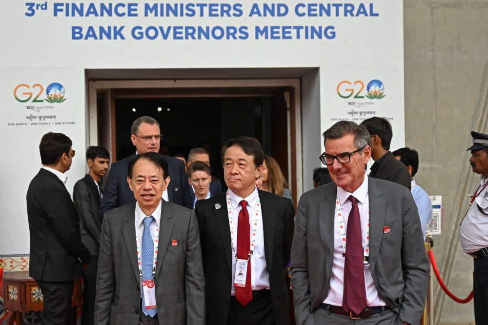 Delegates come out during a break at the G20 Finance Ministers, Central Bank Governors (FMCBG) and Finance & Central Bank Deputies (FCBD) meetings, at the Mahatma Mandir in Gandhinagar on July 17, 2023. — AFP pic