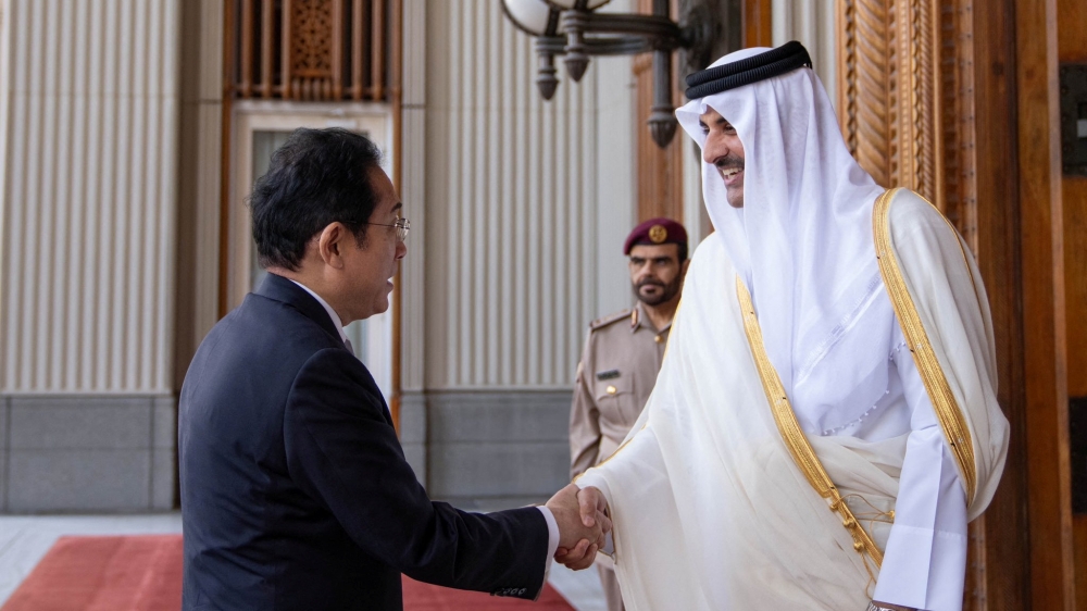 Qatar's Emir Sheikh Tamim Bin Hamad Al-Thani shakes hands with Japan's Prime Minister Fumio Kishida at the Amiri Diwan in Doha, Qatar July 18, 2023. — Amiri Diwan handout pic via Reuters