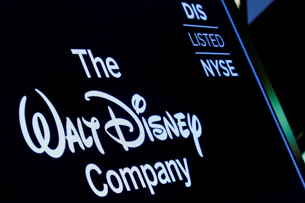 A screen shows the logo and a ticker symbol for The Walt Disney Company on the floor of the New York Stock Exchange (NYSE) in New York December 14, 2017. — Reuters pic