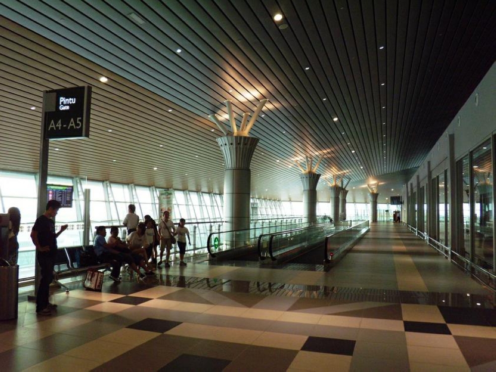 Passengers are seen waiting for flights at the Kota Kinabalu International Airport. — AFP pic
